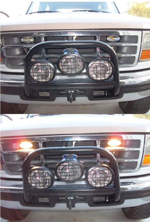 1996 Ford Bronco - Front view of a 1996 Ford Bronco, its grille, bull bar, and auxiliary lights, with the turn signals illuminated in the second image.