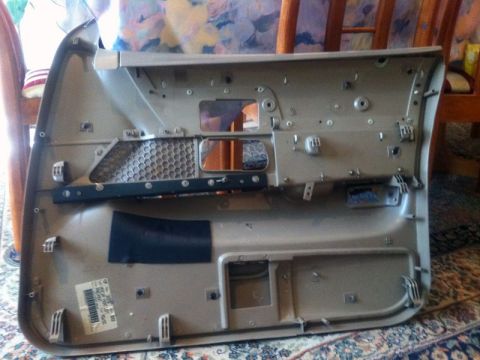 2001 Mercury Grand Marquis - Interior view of a car door panel, showing mounting points and internal structure.