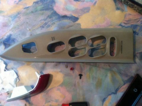 2001 Mercury Grand Marquis - A car door interior trim panel with visible text for door lock and window lock controls is shown disassembled.