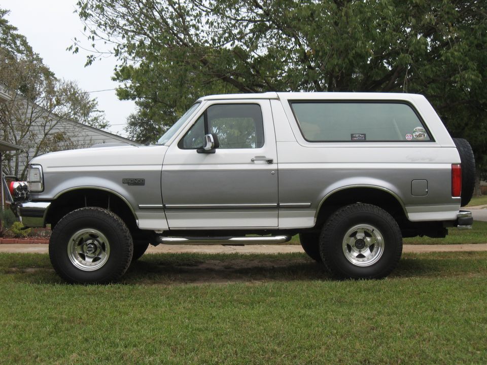 Side view of a 1994 Ford Bronco in white and silver two-tone