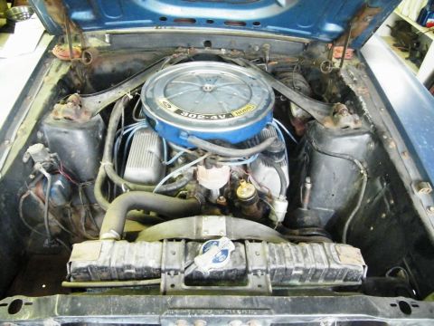 1970 Ford Mustang - Engine bay view of a blue Ford Mustang, showing the 302-4V engine and radiator.