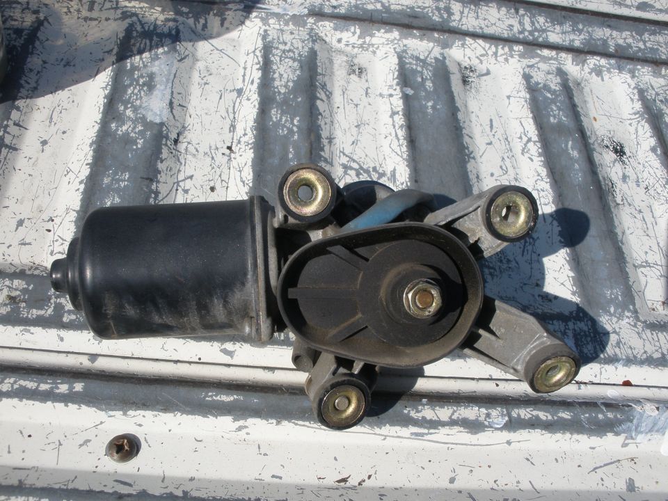 Windshield wiper motor assembly with black housing and metal mounting bracket