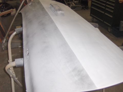 1972 Chevrolet Camaro - A car door, likely undergoing bodywork, is shown being prepped for paint.
