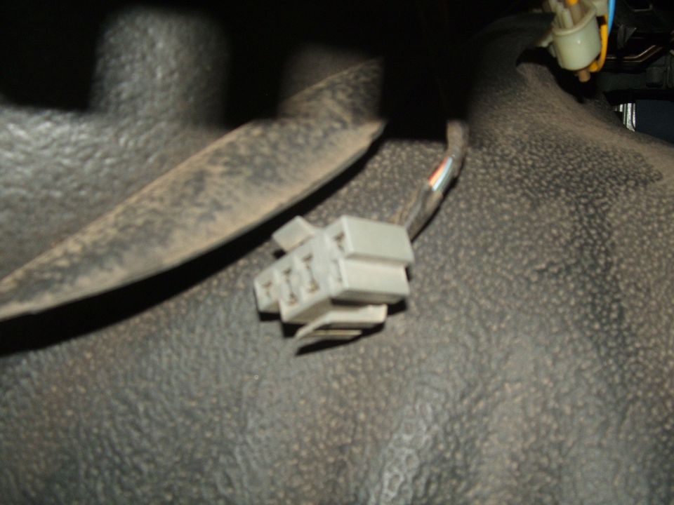 close-up of a gray electrical connector with wires