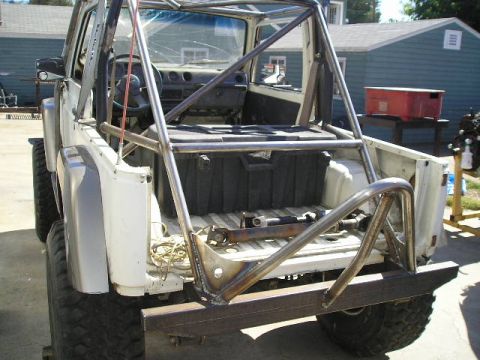 1987 Suzuki Samurai - This Suzuki Samurai has been modified with a substantial roll cage and a new rear bumper.
