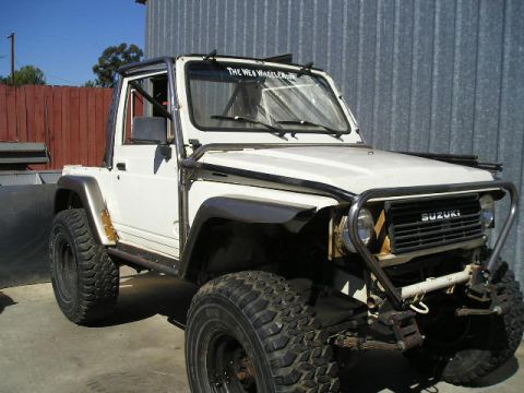 1987 Suzuki Samurai - This 1987 Suzuki Samurai is modified with a roll cage and off-road tires.