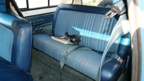 1978 Ford Bronco - Interior view of a 1978 Ford Bronco, showing the rear bench seat and seatbelts.