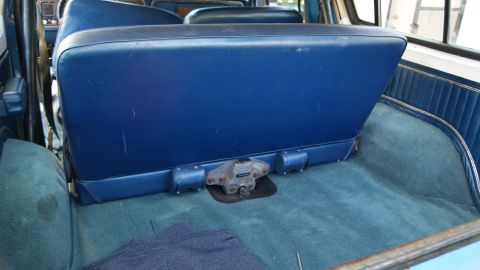 1978 Ford Bronco - The interior of a 1978 Ford Bronco shows the rear seat and blue carpeting.
