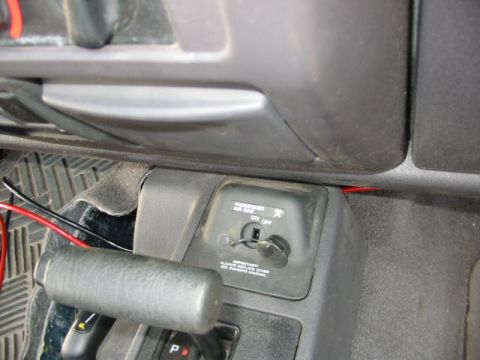 2002 Jeep Wrangler - Interior view of a 2002 Jeep Wrangler, highlighting the gear shifter and passenger airbag control.