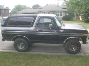 1979 Ford F-150 - This 1978 Ford Bronco is seen from the side, a two-tone black and white paint scheme.
