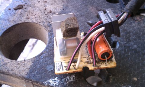 1990 Ford Bronco - Circuit board with wires and capacitor, possibly a wiper motor control module.