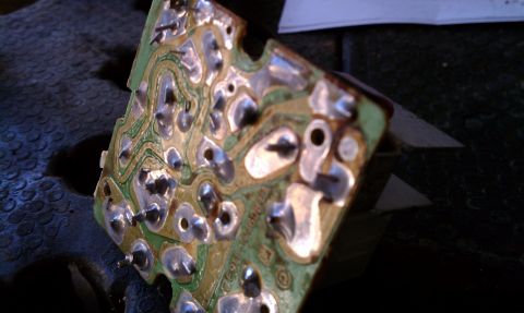 1990 Ford Bronco - This circuit board shows intricate wiring and solder connections, likely for a vehicle component.