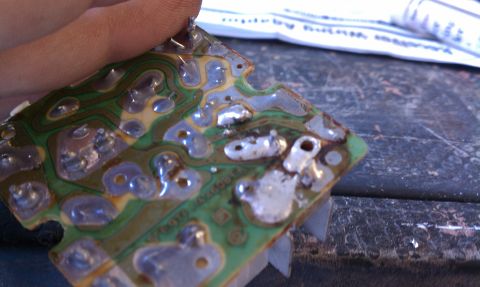 1990 Ford Bronco - Close-up of a circuit board, possibly for wiper repair, with visible solder joints and traces.