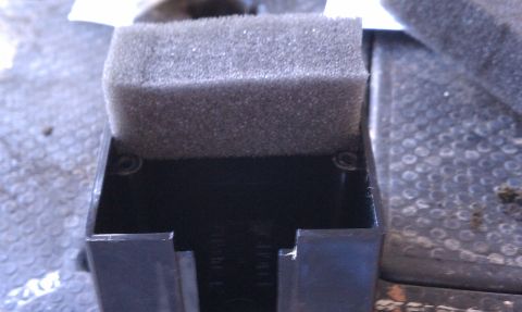 1990 Ford Bronco - Close-up of a black plastic part with a foam insert, the Supermotors.net logo at the bottom right.