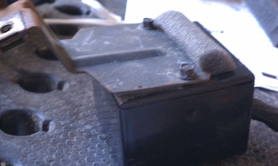 Black wiper repair part with metal bracket and foam padding