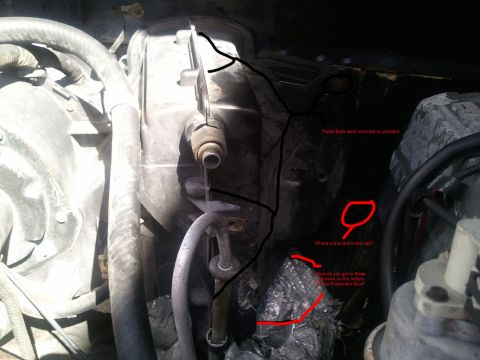 1994 Ford Bronco - Engine-bay firewall view showing the HVAC evaporator box housing with AC lines and heater hoses, annotated with red and black marker for a…