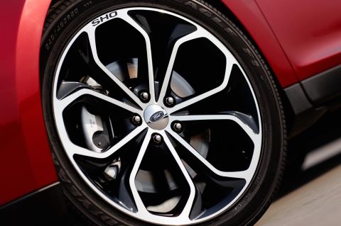 1993 Ford Taurus - Close-up of a Ford Taurus SHO wheel, showing the distinctive alloy design and 'SHO' badging.