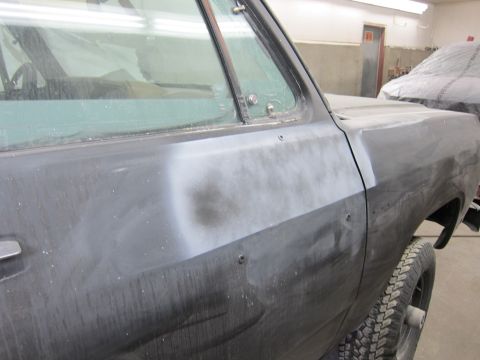 1987 Dodge 1500 - Primer applied to the body of a 1987 Dodge 1500 truck during bodywork.