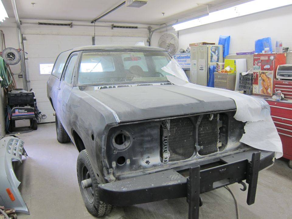 1987 Dodge 1500 front view in garage, primer finish