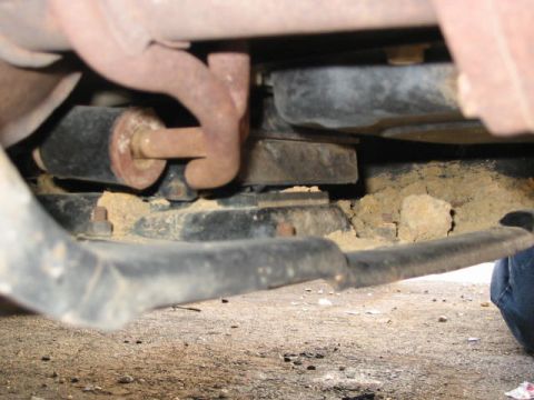 2002 Jeep Wrangler - The underside of a vehicle shows significant dirt and rust, suggesting it is not a new model.