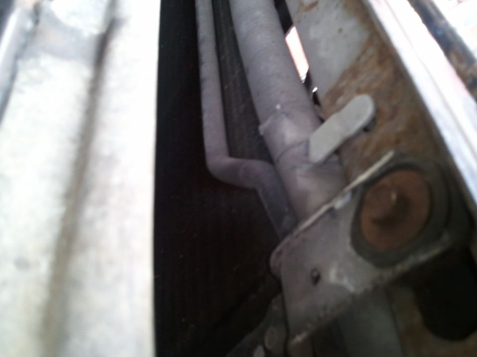 close-up of exhaust pipe and metal bracket