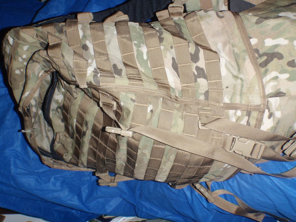 Multicam tactical backpack with MOLLE webbing and buckle straps