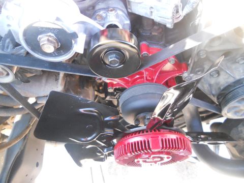 1991 Ford Bronco - Close-up view of engine fan, belt, and pulley system.