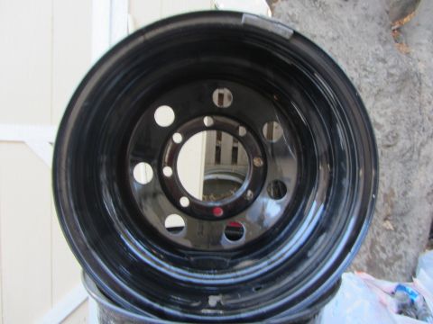1987 Suzuki Samurai - This is a black steel wheel with a 5x5.5 bolt pattern, likely for a truck or SUV.
