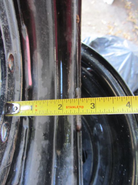 1987 Suzuki Samurai - Close-up of a black wheel rim with a measuring tape indicating a width of about 3 inches.