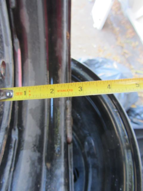 1987 Suzuki Samurai - Close-up of a black rim with a measuring tape indicating a width of about 2.5 inches.