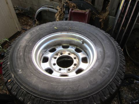 1987 Suzuki Samurai - A close-up view of a tire and rim, with "BIG FOOT" clearly visible on the tire's sidewall.
