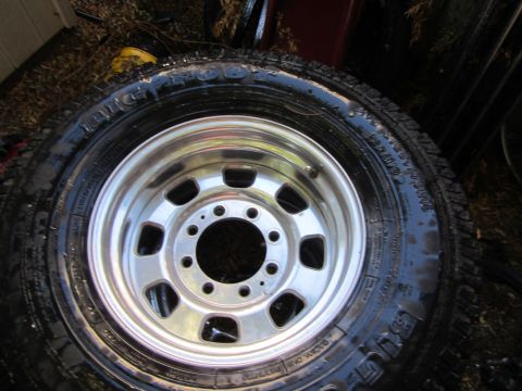 1987 Suzuki Samurai - Close-up of a single wheel and tire assembly, likely for an off-road vehicle.