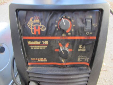 1987 Suzuki Samurai - Close-up of a Handler 140 welder's control panel, showing various settings and indicators.