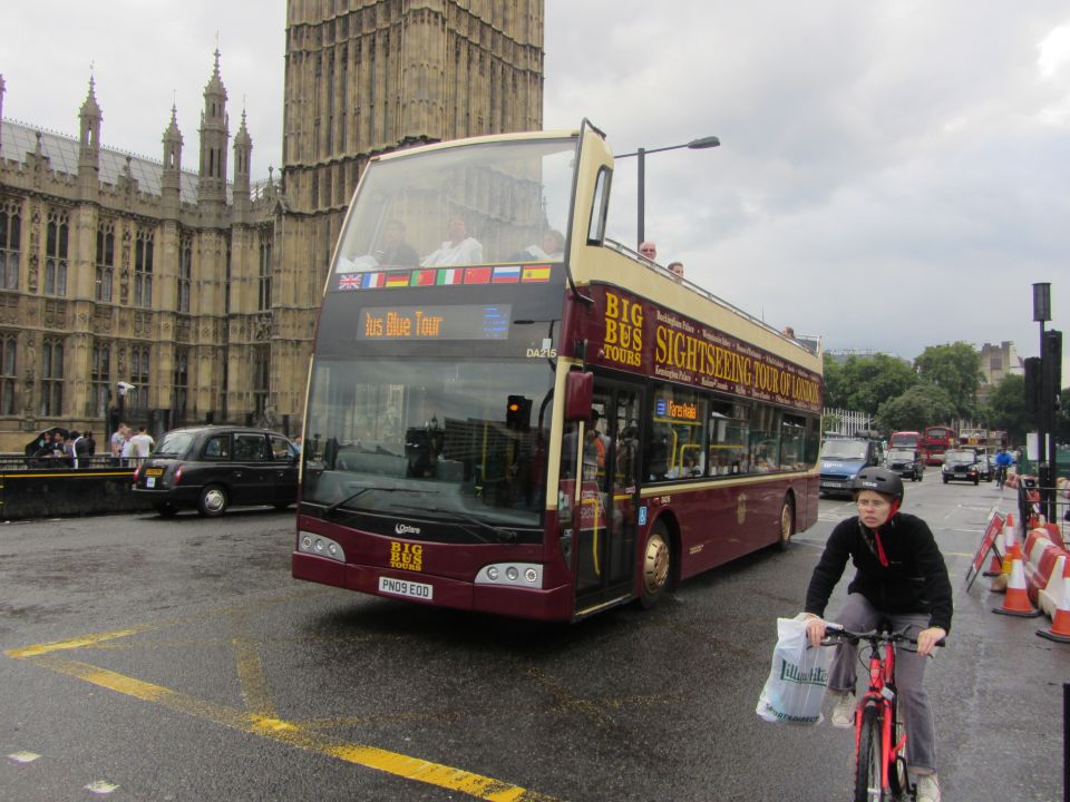Maroon double-decker Big Bus Tours vehicle with 'Jus Blue Tour' displayed