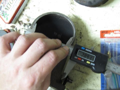1993 Ford F-250 - A digital caliper is used to measure the diameter of a cylindrical component.