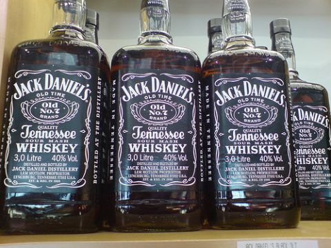 1988 Ford Bronco - Several bottles of Jack Daniel's Old No. 7 Tennessee Sour Mash Whiskey are lined up on a shelf.