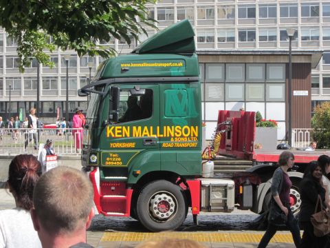 1968 Ford Mustang - A green semi-truck with red accents and "Ken Mallinson Yorkshire" branding is seen from the side.