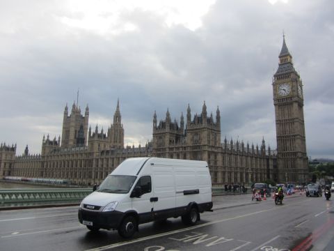 1968 Ford Mustang - A white panel van drives across Westminster Bridge, London, with the Houses of Parliament and Big Ben visible.