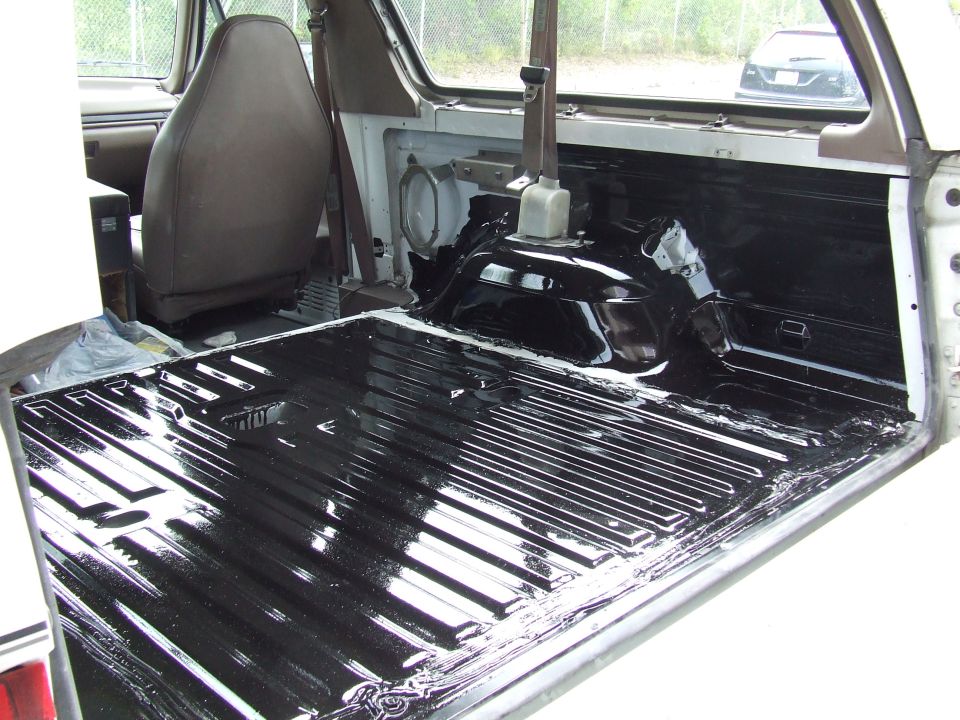 1996 Ford Bronco interior cargo area with black bed liner