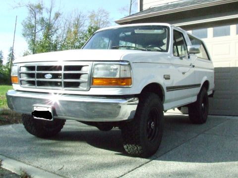 1996 Ford Bronco - This white Ford Bronco is shown from a three-quarter front angle.