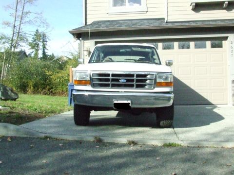 1996 Ford Bronco - Front view of a white 1996 Ford Bronco parked in a driveway.