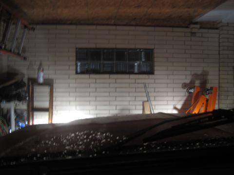 1979 Ford Bronco - View from inside a vehicle, showing the dashboard and windshield covered in water spots.