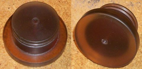 1996 Ford Bronco - This is a dark brown plastic cap with threaded sides and a central hole.