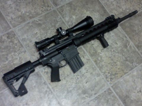 1996 Ford Bronco - An assault rifle equipped with a scope and an adjustable stock is displayed on a tiled floor.