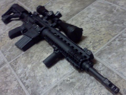 1996 Ford Bronco - AR-15 style rifle with scope and extended magazine is shown on a tiled surface.