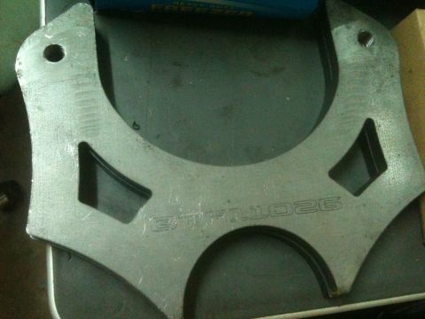 1992 Jeep YJ - A metal bracket with part number BTF-1026 is shown up close.