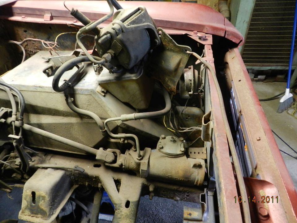 Engine bay view of steering box and brake booster assembly