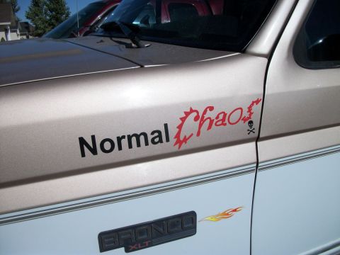 1996 Ford Bronco - A "Normal Chaos" decal and "BRONCO XLT" badge are visible on the side of this Ford Bronco.