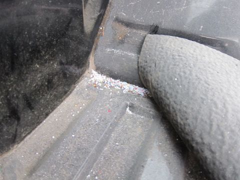 1987 Dodge 1500 - Debris collected in the corner of a truck bed liner.