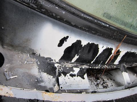 1987 Dodge 1500 - Peeling paint and debris are visible on the car's bodywork near the windshield base.